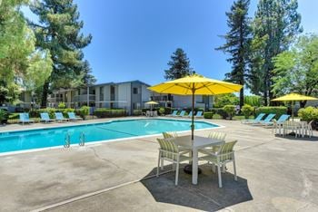 Swimming pool with lounge seating and tables